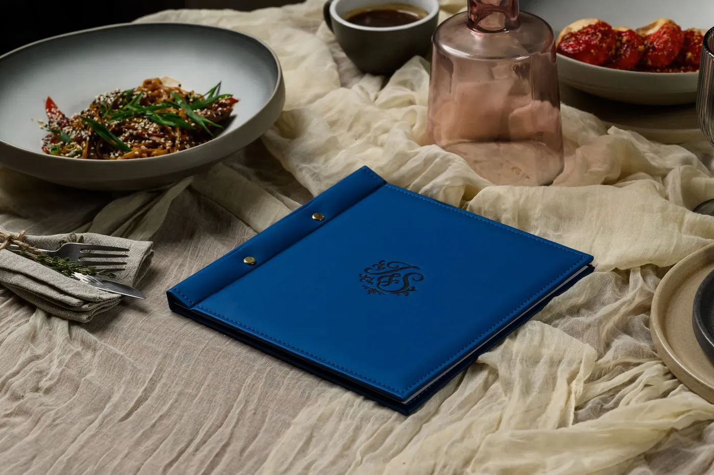 Blue leather menu folder, embossed logo