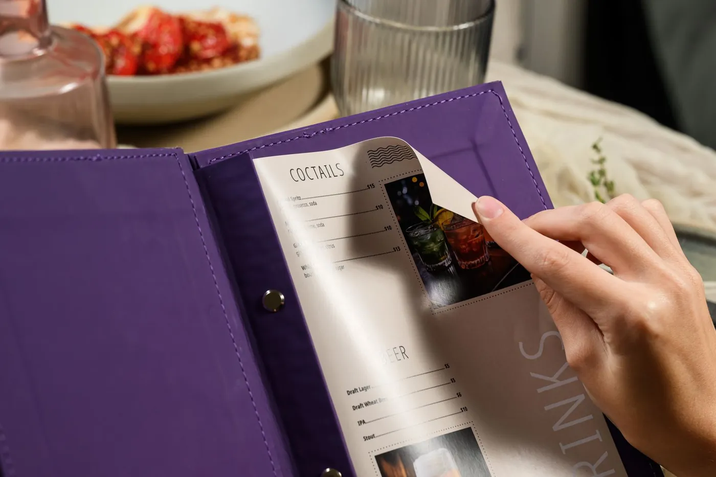 Purple leather cocktail menu · screw binding